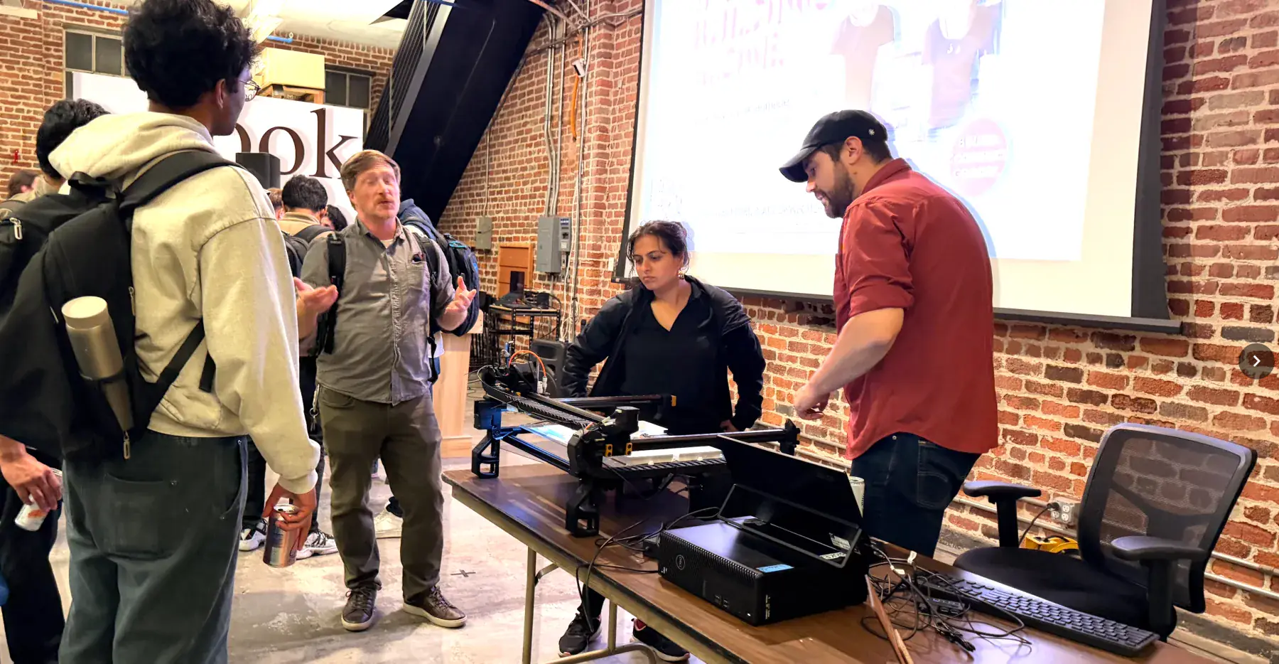 Builders presenting projects at a Worldwide Studios demo night