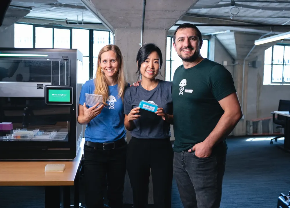 Benchling team members with lab automation equipment