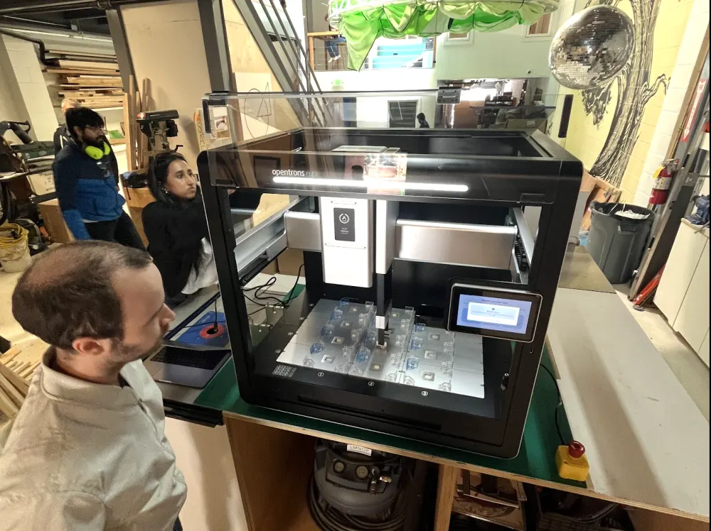 An Opentrons Flex robot in the Worldwide Studios workshop